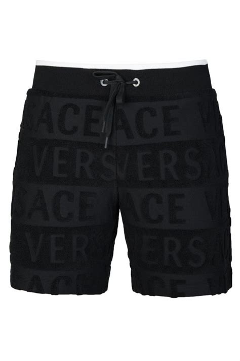 versace velour sweatpants|Versace denim shorts.